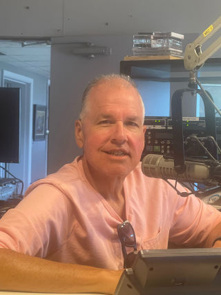 Wade at the controls, in the radio station